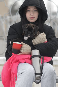 Portrait of woman with dog