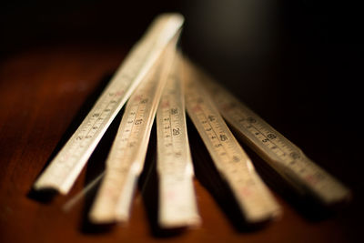 High angle view of wooden folding ruler on table