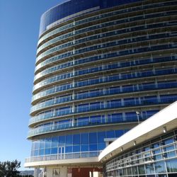 Low angle view of modern building against blue sky