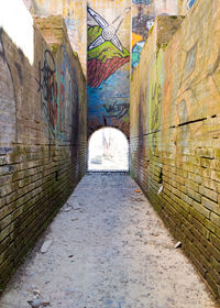 Tunnel amidst walls