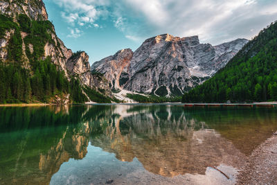 Scenic view of lake and mountains against sky