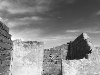 Old building against cloudy sky