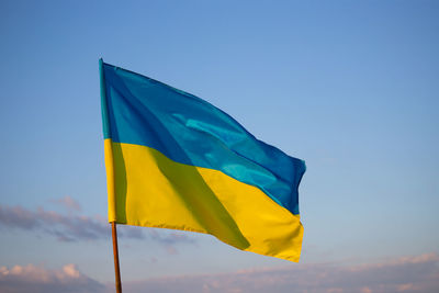 Low angle view of flag against sky