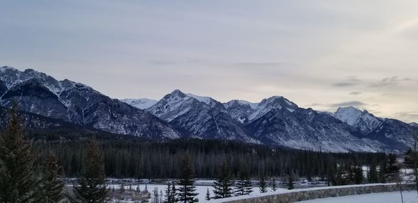 Scenic view of snowcapped mountains against sky