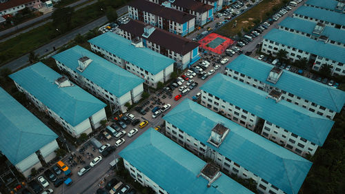 High angle view of swimming pool by buildings in city