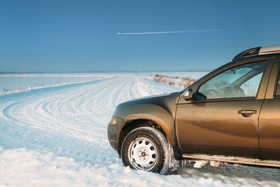 Car on snow covered landscape