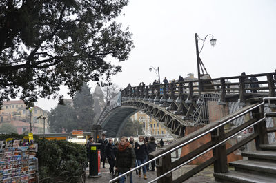 People walking on footbridge