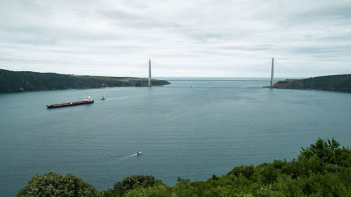 Scenic view of bay bridge against sky