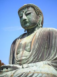 Low angle view of buddha statue