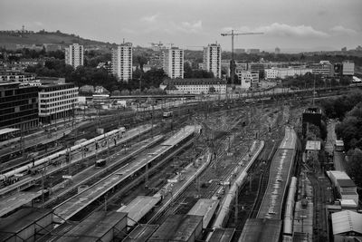 High angle view of railroad tracks against sky in city