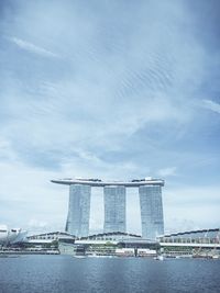 View of bridge over river against cloudy sky