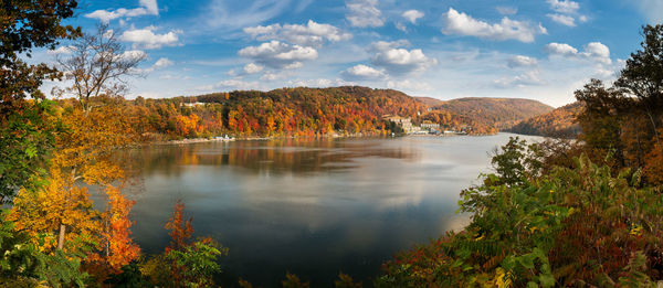 Scenic view of lake against sky during autumn