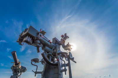 Low angle view of traditional windmill against sky