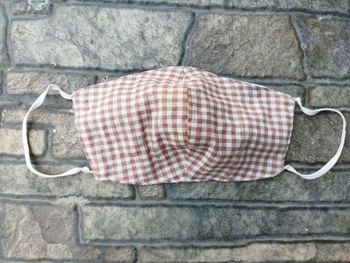 Close-up of clothes drying against wall
