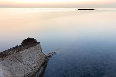 Scenic view of sea against sky at sunset