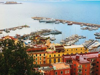 High angle view of harbor by buildings in city