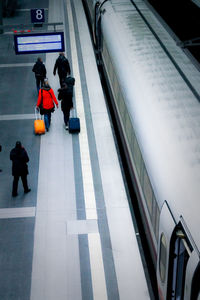 High angle view of people walking in subway