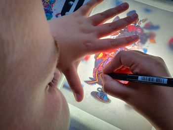 High angle view of woman holding hands