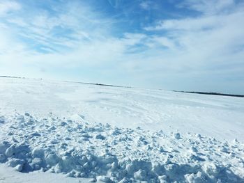 Scenic view of frozen lake against sky