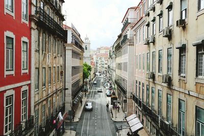 Street amidst residential buildings against sky