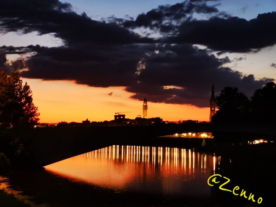 cloud - sky, sky, sunset, water, reflection, nature, no people, illuminated, architecture, built structure, orange color, silhouette, tree, plant, river, building exterior, beauty in nature, dusk, outdoors