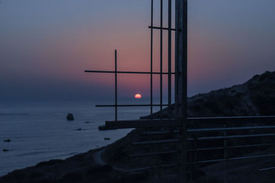 Scenic view of sea against sky at dusk
