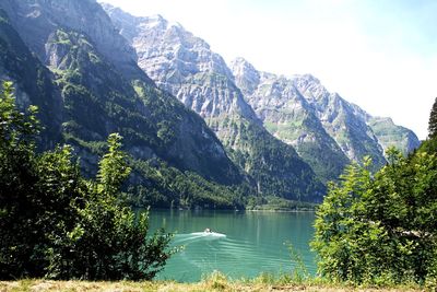 Scenic view of lake and mountains against sky