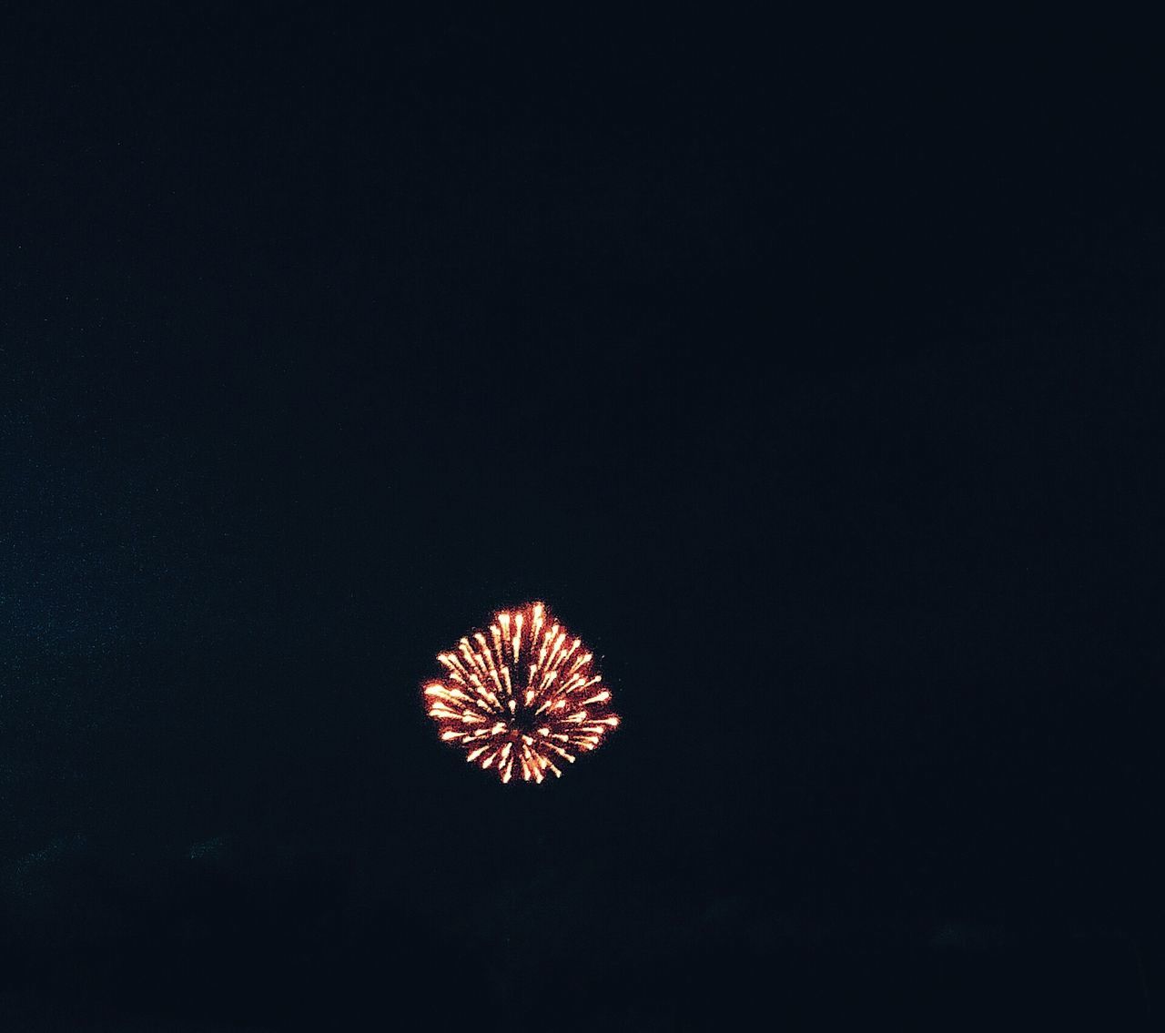 night, illuminated, low angle view, celebration, copy space, firework display, exploding, glowing, clear sky, sky, arts culture and entertainment, dark, firework - man made object, sparks, long exposure, event, no people, outdoors, studio shot, motion