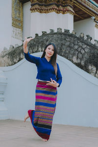 Thai women wearing beautiful traditional costumes.