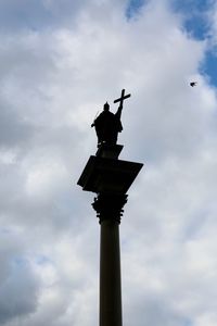 Low angle view of statue against cloudy sky