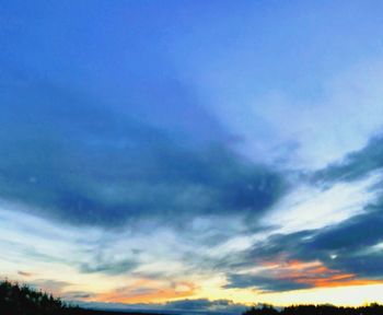 Low angle view of cloudy sky during sunset