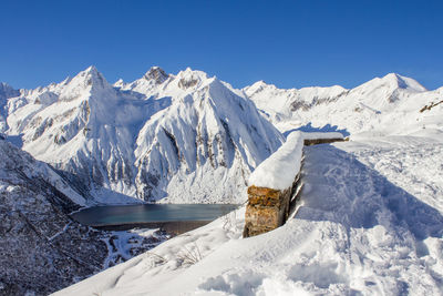 Scenic view of snowcapped mountains against sky