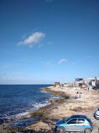 Scenic view of sea against blue sky