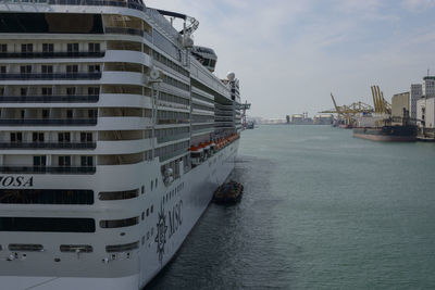 Panoramic view of city by sea against sky