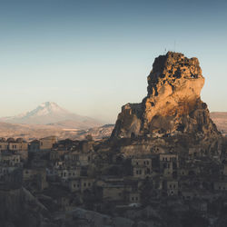 Rock formations on mountain against sky