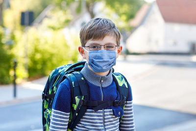 Portrait of boy standing outdoors