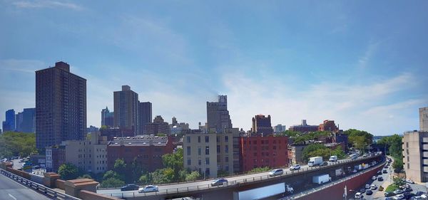 Modern buildings in city against sky