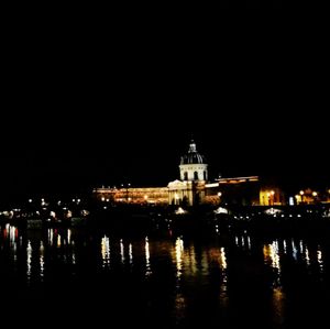 Reflection of illuminated built structures in water