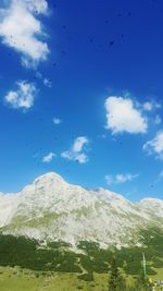 Low angle view of mountain against cloudy sky