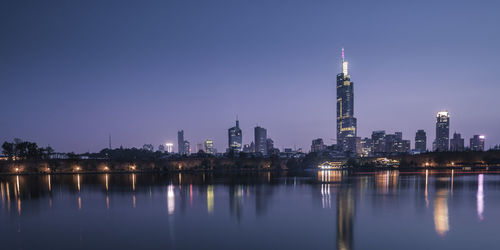 Illuminated buildings in city at night