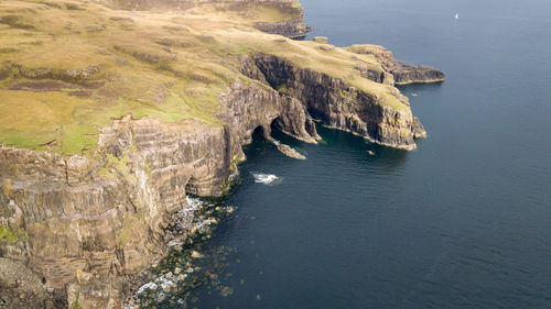 High angle view of sea by cliff