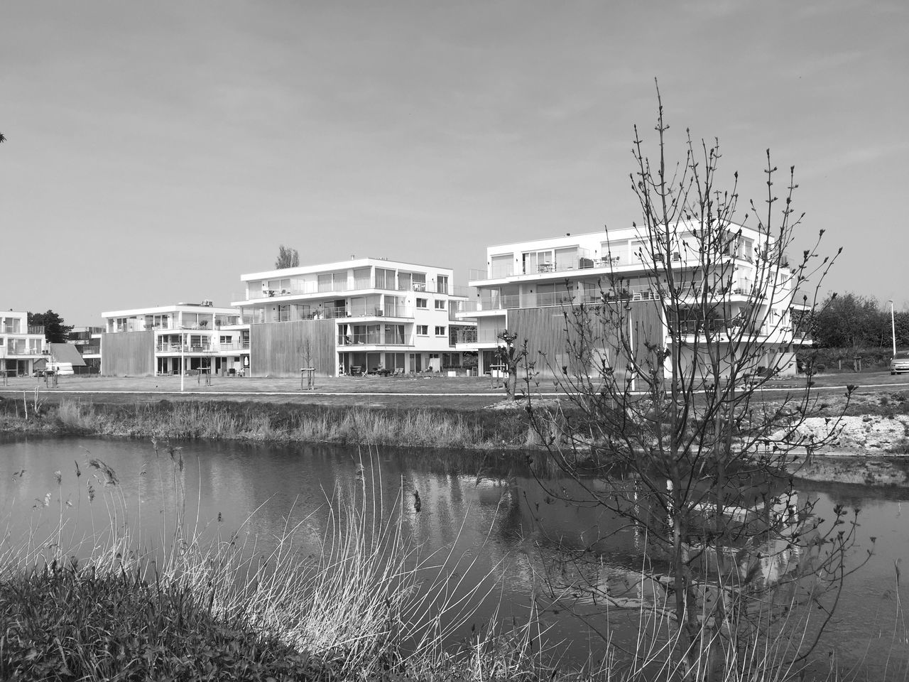 REFLECTION OF BUILDINGS IN RIVER