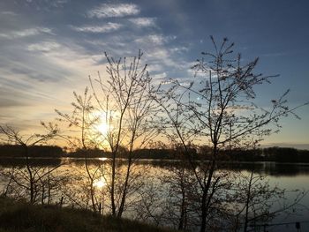 Scenic view of lake at sunset