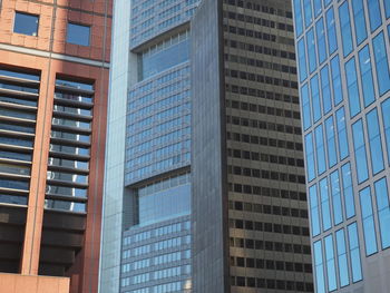 Low angle view of office building against sky