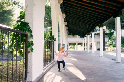 Woman sitting on bridge