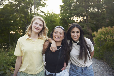 Portrait of happy female friends spending time together outdoors