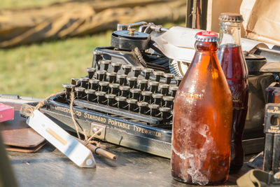 Close-up of old bottle on table