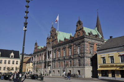 View of buildings in city against clear sky