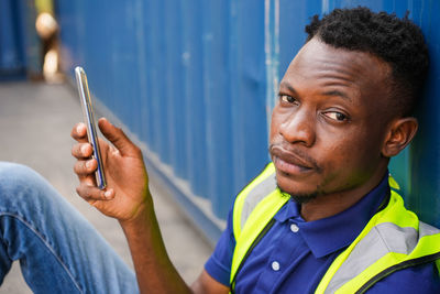 Portrait of young man looking at camera