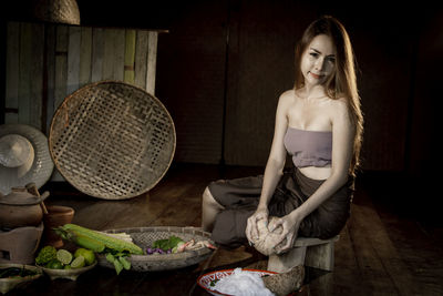 Portrait of a young woman sitting outdoors